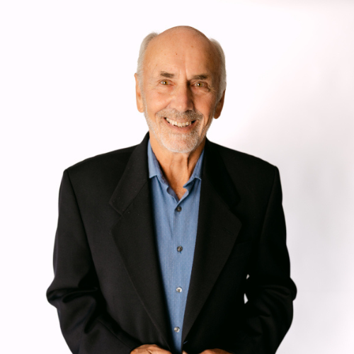 Mark Bolt, smiling man in black blazer and blue shirt