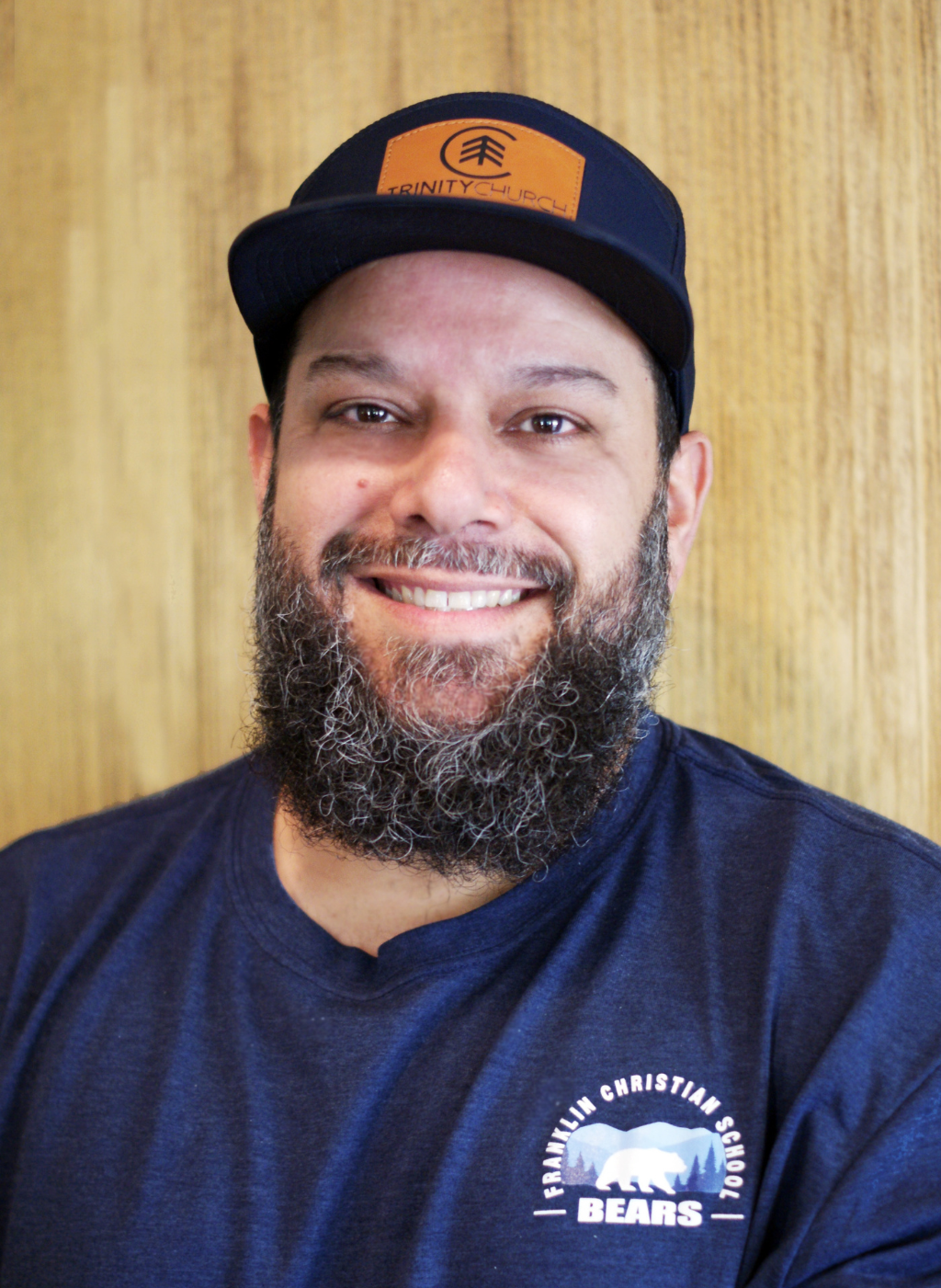 Sam Cordero, Franklin Christian School Bears staff member, wearing a navy t-shirt and hat.